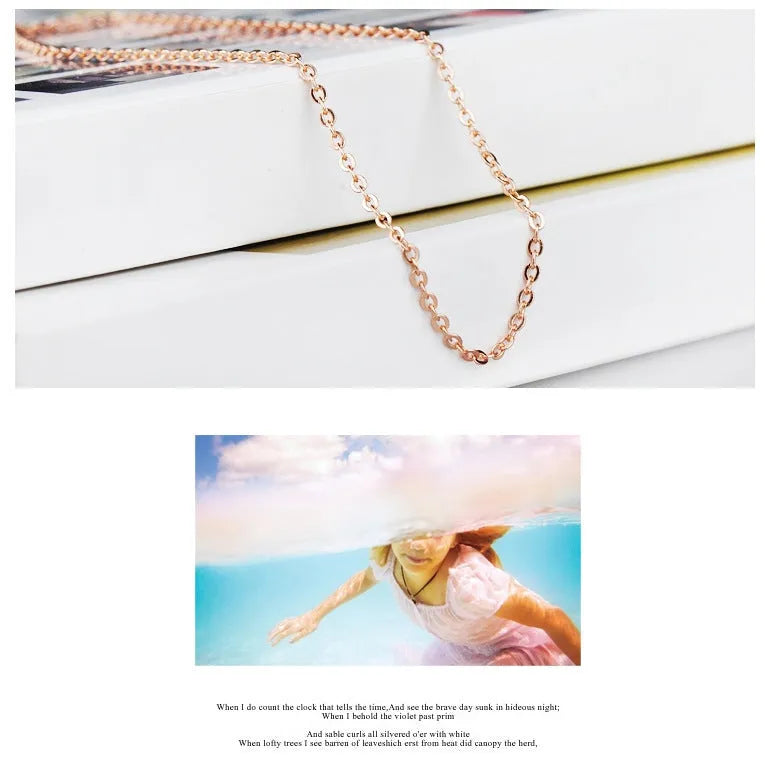 Women's heart-shaped pink crystal pendant necklace with rose gold finish and cross chain