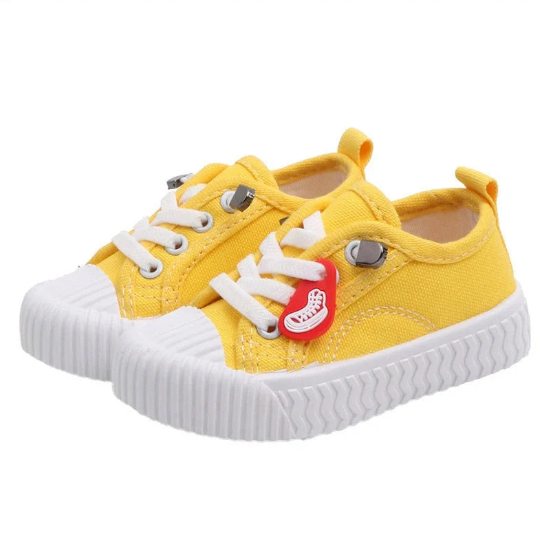 Korean style children's canvas shoes in black, red, yellow or white with non-slip rubber soles