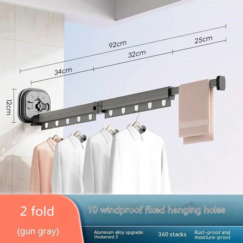 Aluminum retractable drying rack mounted on a window, extending outward for clothes drying