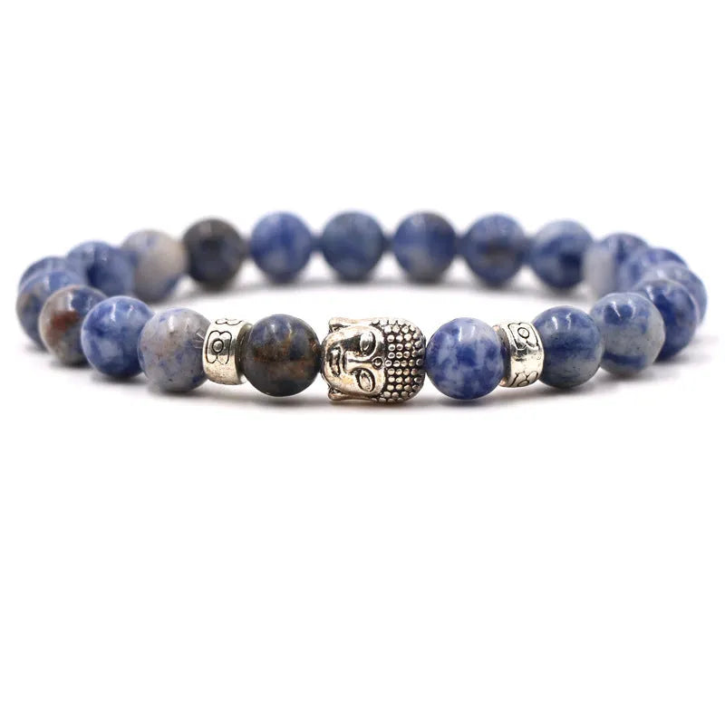 Natural stone stretch bracelet with round beads in various colours including Tigereye and turquoise.