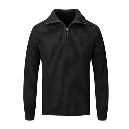 A man wearing a solid-colour slim-fit loose pullover sweater in a neutral colour.