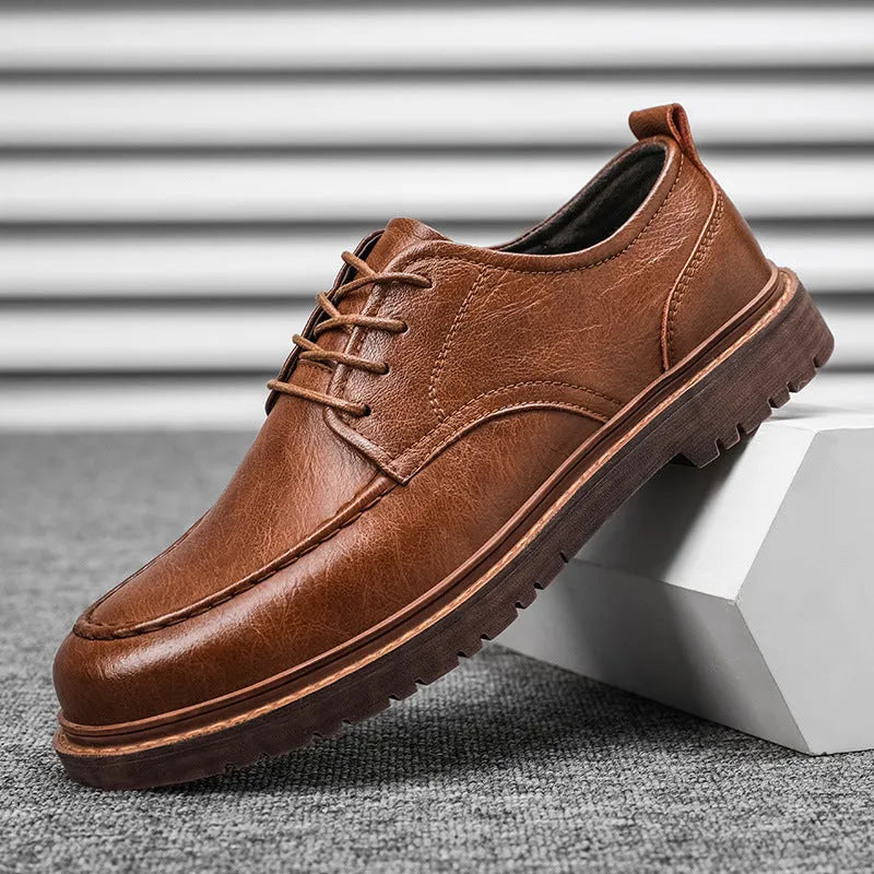 Brown casual leather shoes with round toe, flat heel, and visible sewing lines on the cowhide upper.