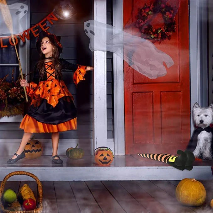 Halloween witch leg decoration with striped stockings and black boots