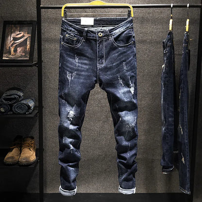 Men's slim-fitting dark blue denim jeans with micro-elasticity, mid-waist design, and standard trousers length on hanger