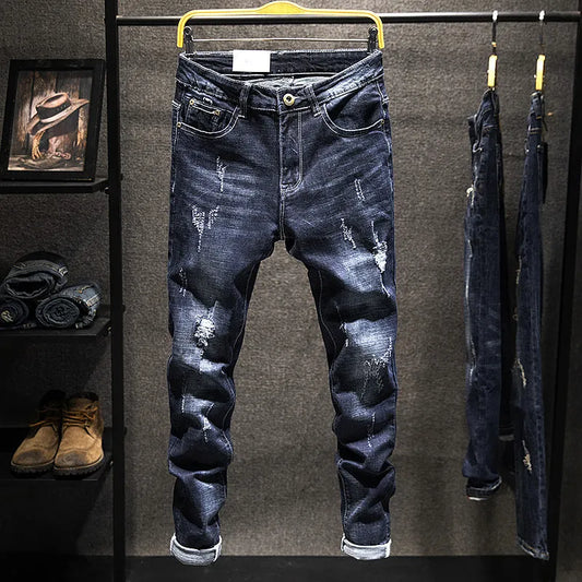 Men's slim-fitting dark blue denim jeans with micro-elasticity, mid-waist design, and standard trousers length on hanger