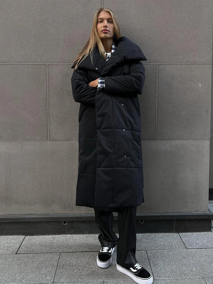 Cozy women's long winter coat with large lapel, lace-up design, and pockets for optimal warmth and style