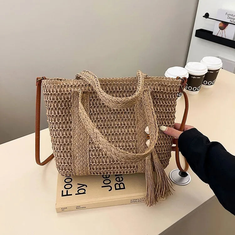Women's large capacity straw crossbody bag in milky white or khaki with soft woven body and shoulder strap