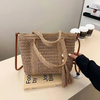 Women's large capacity straw crossbody bag in milky white or khaki with soft woven body and shoulder strap