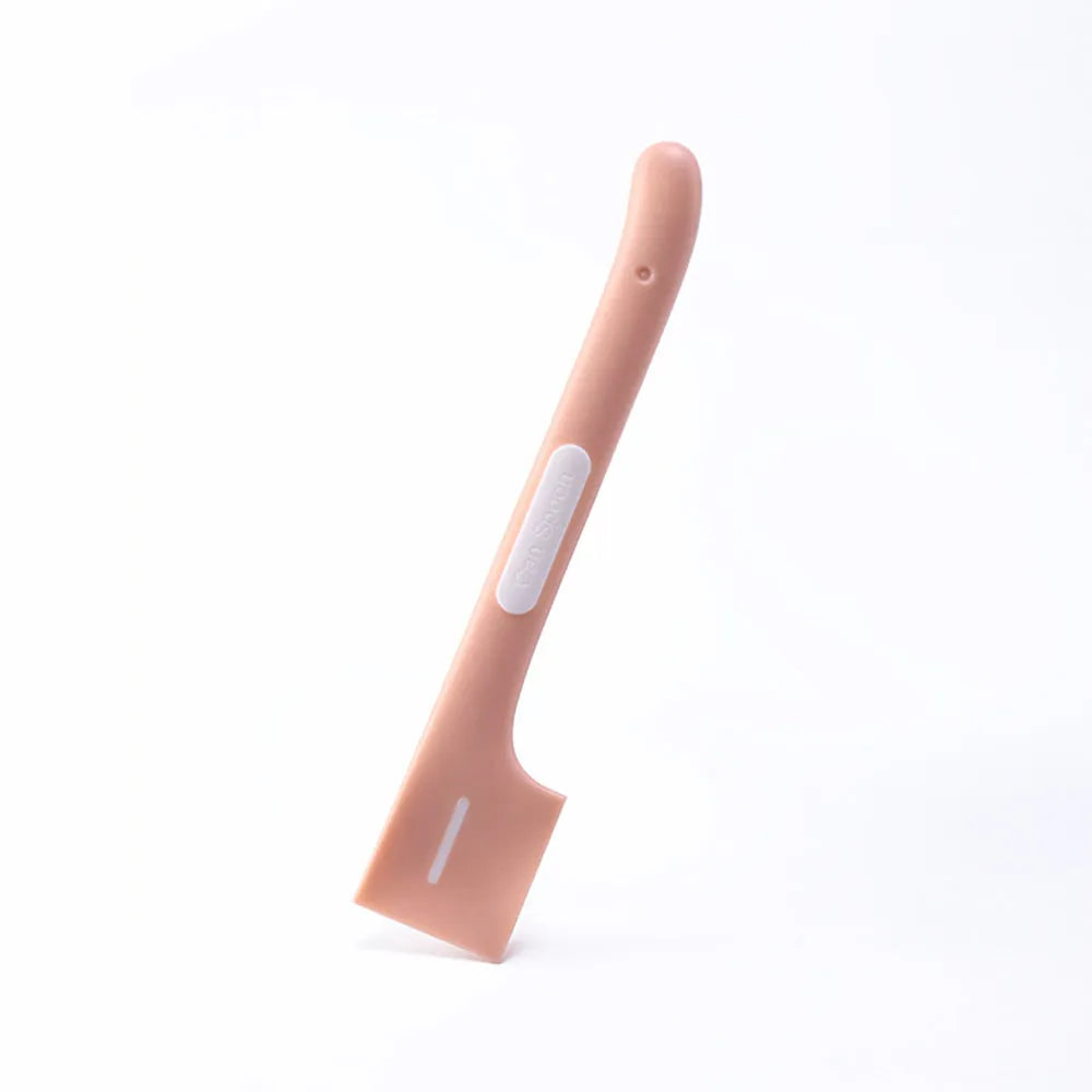 Green long-handled plastic spoon for scooping pet food from a can.