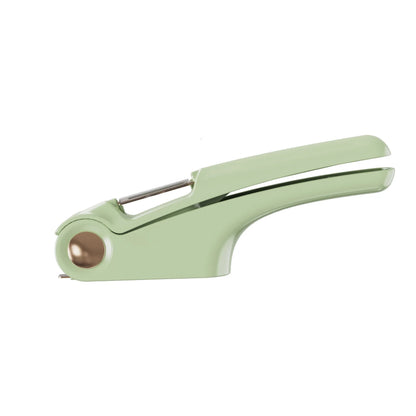White manual garlic press with stainless steel mechanism on wooden kitchen surface