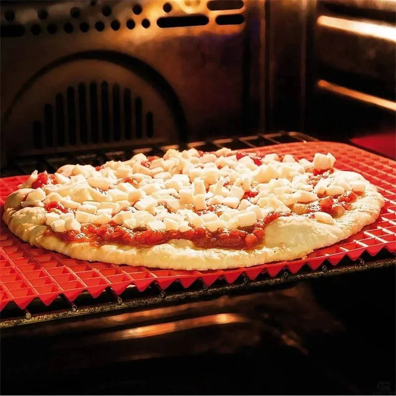 Red silicone pyramid grid cooking mat on a kitchen counter