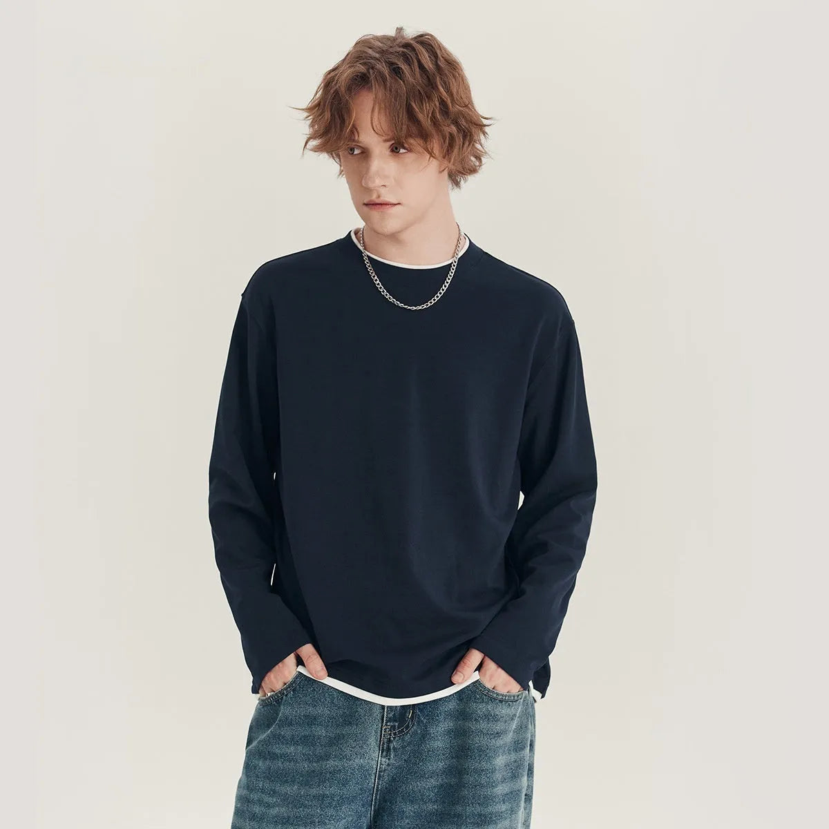 Men's loose fit long-sleeved cotton blend t-shirt in solid colour on hanger