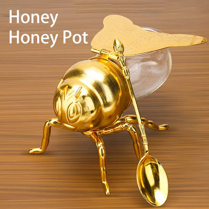Bee-shaped honey jar with spoon, perfect for kitchen condiment storage