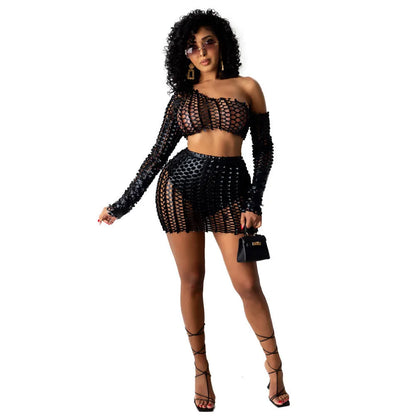 Women's black hollow-out net sleeveless top and short skirt two-piece set.