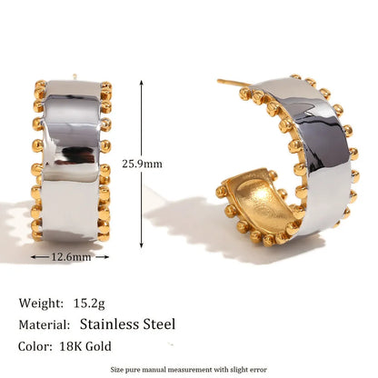 Gold electroplated stainless steel earrings, necklace, and bracelet set with geometric shapes and round ring elements