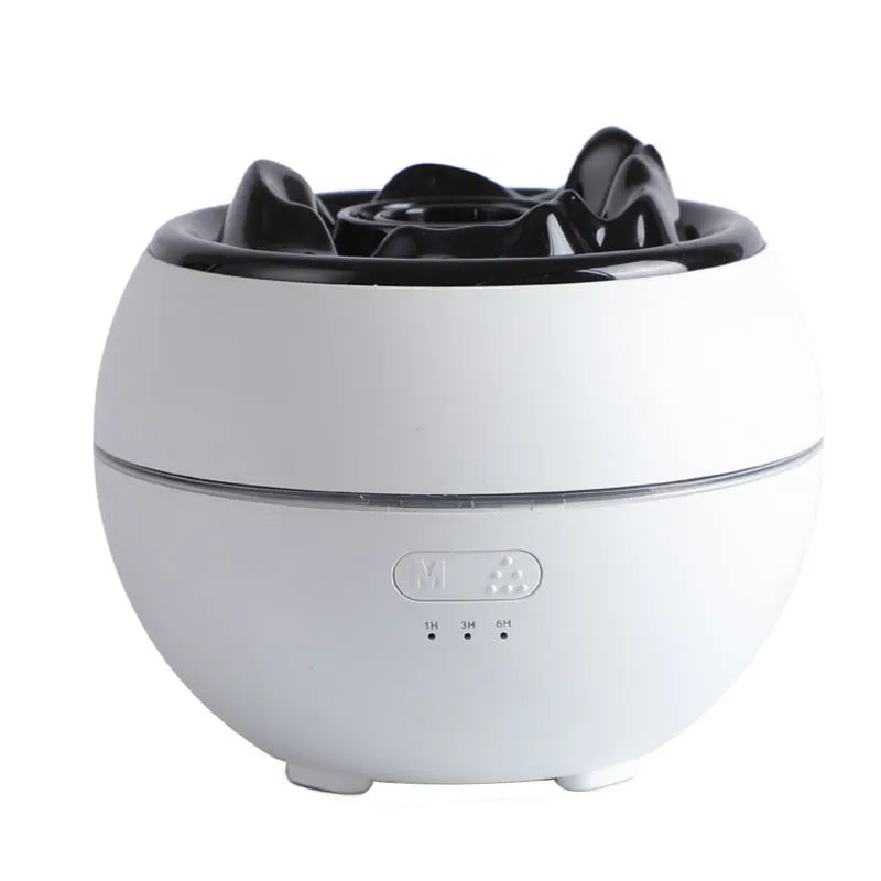 White flame aroma diffuser humidifier with round shape on wooden desk