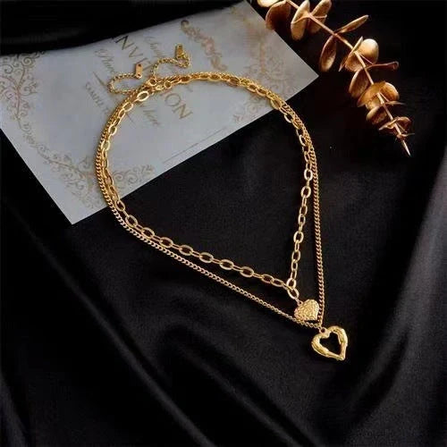 Stylish Titanium Steel Angel Wings Heart Necklace for Women in silver and golden finishes.