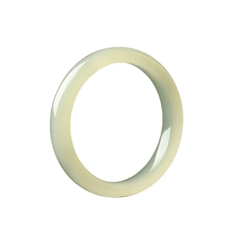 Ice-like silk jade bracelet with winding silk design and round bar beads on a wrist.