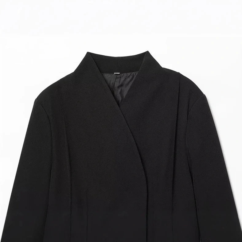Women's black slim-fit suit jacket with regular sleeves on hanger