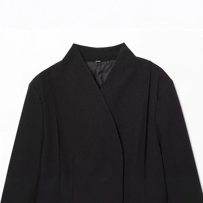 Women's black slim-fit suit jacket with regular sleeves on hanger