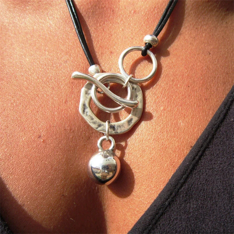 Stylish leather necklace with a boho-chic buckle detail, perfect for adding a touch of rustic charm to any outfit.