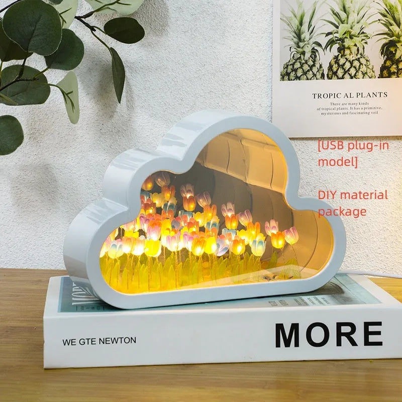 DIY tulip-shaped night lamp kit with LED lights and mirror surface in assorted colours on a desk.