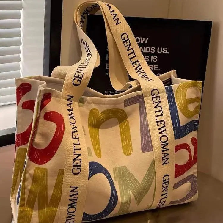 Canvas women's travel tote bag with printed patterns and shoulder straps