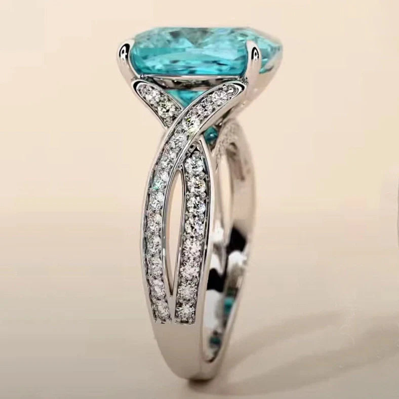 Adjustable women's ring with 4mm square blue zircon stone on silver-tone band