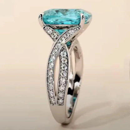 Adjustable women's ring with 4mm square blue zircon stone on silver-tone band