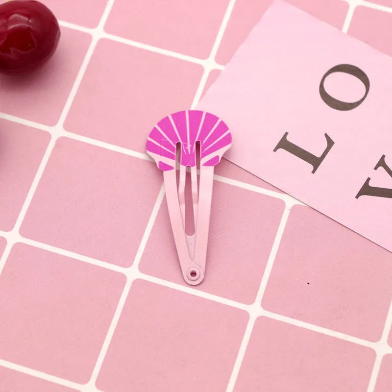 Colourful metal hair barrettes for children with printed watermelon, strawberry, pineapple and Christmas designs.
