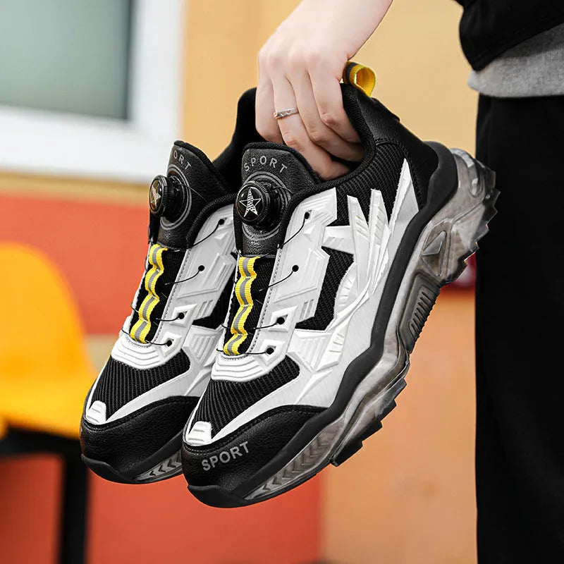 Men's black mesh dad shoes with rotating button detail and a low platform sole