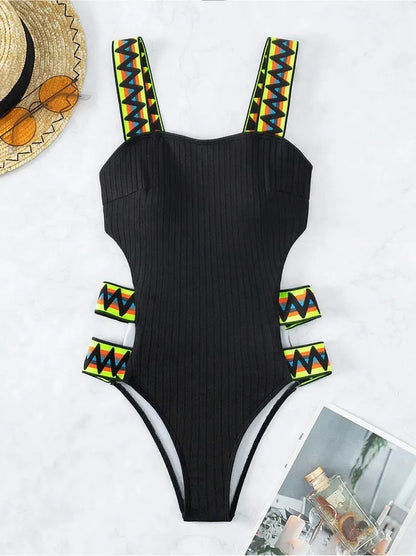 Women's solid colour one-piece swimsuit in black or orange options with polyester fabric construction