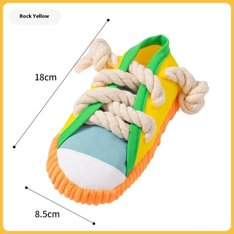 Durable plastic dog chew toy in slipper shape with bends, in yellow, black, or blue.