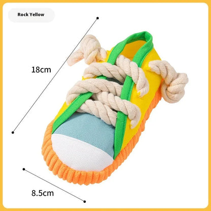 Durable plastic dog chew toy in slipper shape with bends, in yellow, black, or blue.