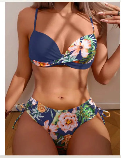 Women's two-piece bikini swimsuit with push-up padding and drawstring design in printed polyester fabric