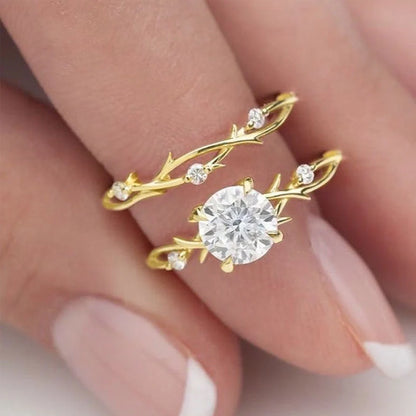 Geometric design rose gold plated couple rings with simulation diamond centrepiece showing faceted edges