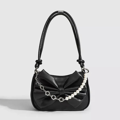 Black and white PU bow handbag with pearl chain, perfect for autumn winter fashion