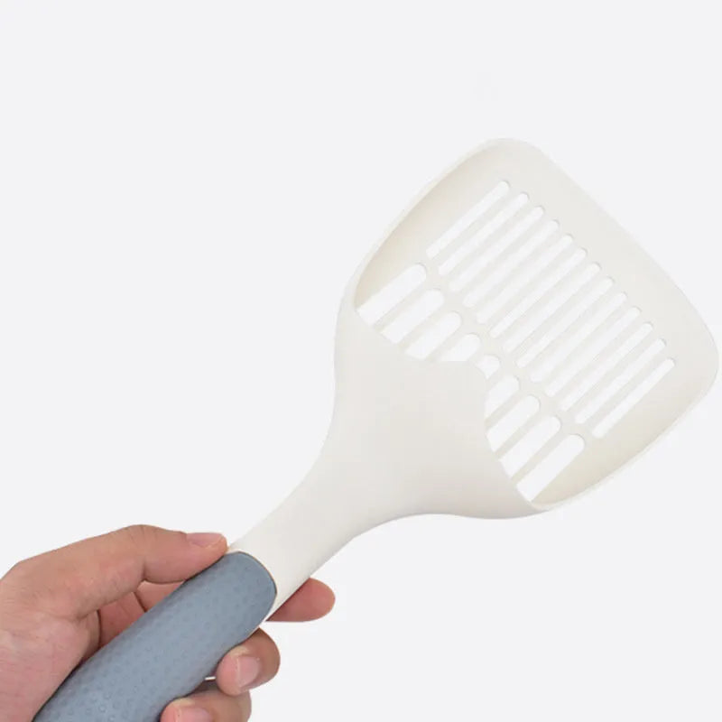 White cat litter shovel with blue detailing, showing large scoop head for pet waste removal
