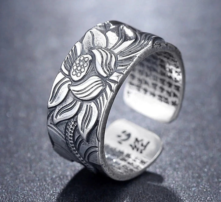 Handcrafted Thai sterling silver ring with intricate Heart Sutra engraving, promoting mental clarity and emotional balance.