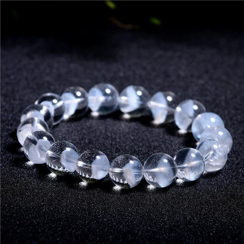 Women's original design bracelet with white crystal ghost pyramid beads and a ruyi decorative element.