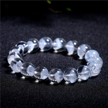 Women's original design bracelet with white crystal ghost pyramid beads and a ruyi decorative element.