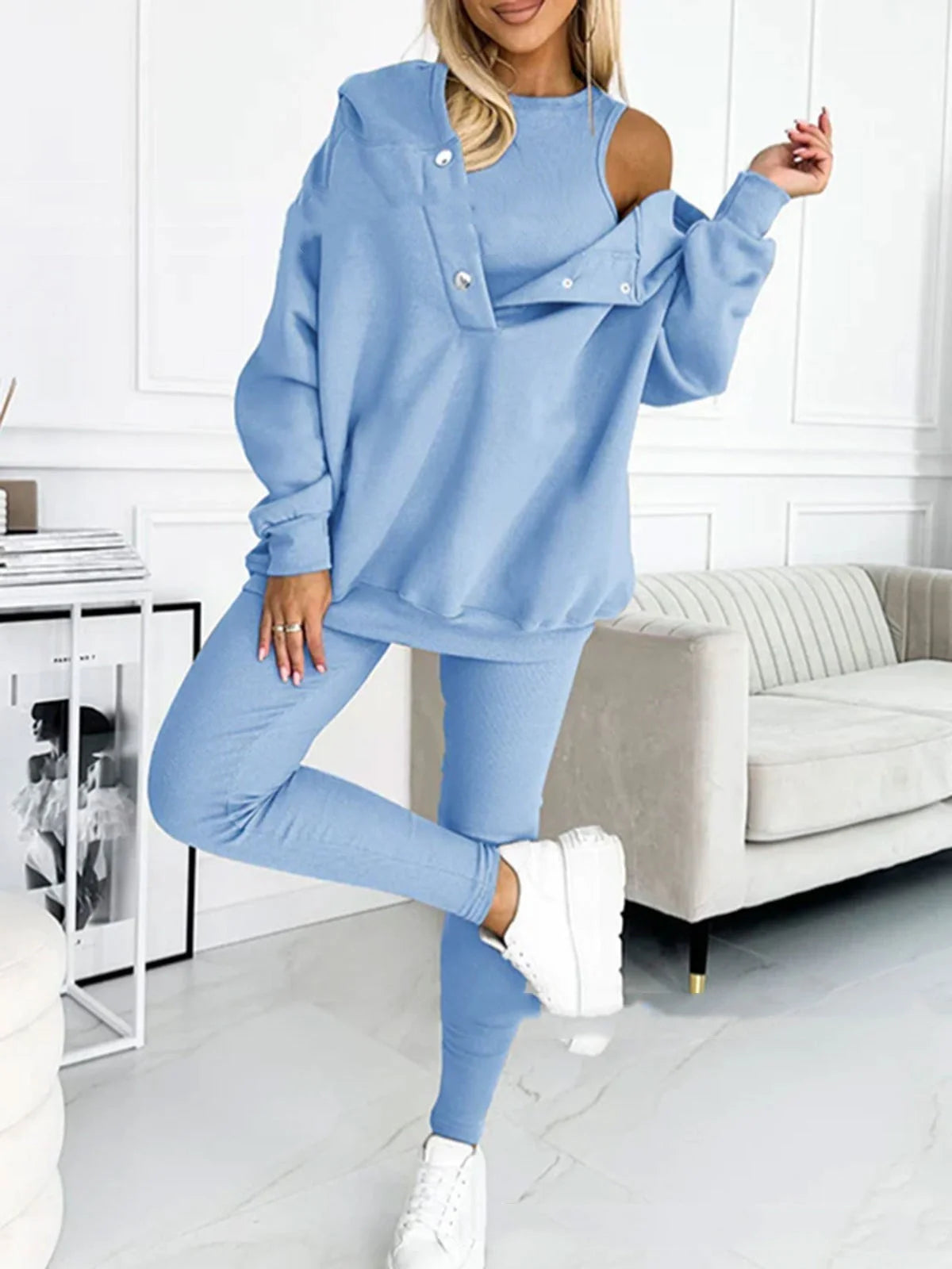 Women's 3-piece sports suit featuring a hooded sweatshirt with pockets and slim trousers