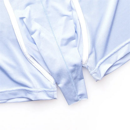 A pair of men's solid colour ice silk boxers on a mid waist model.