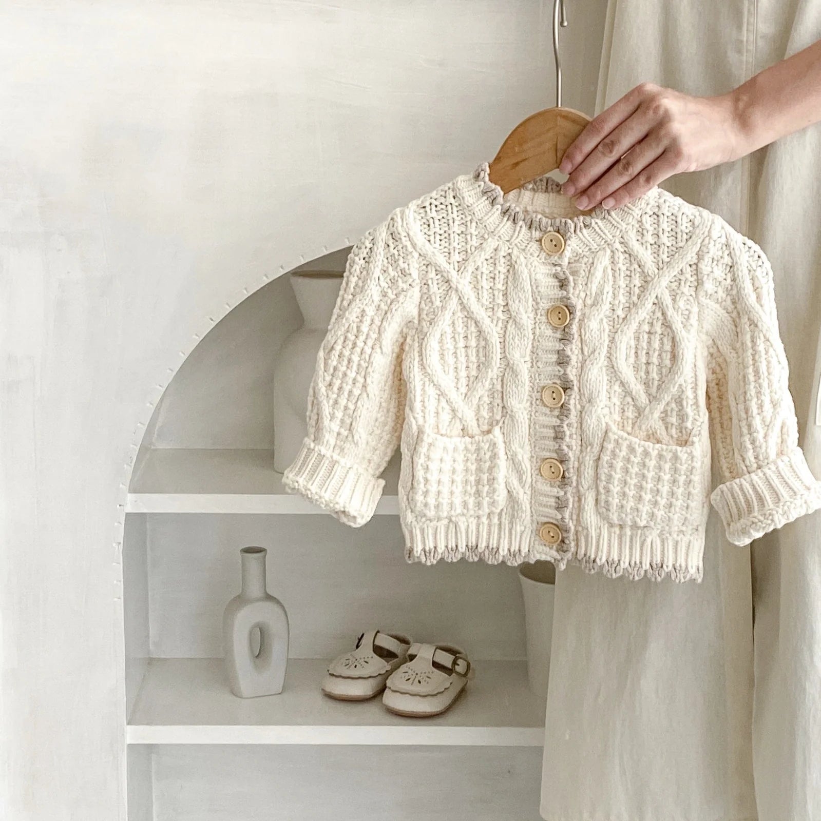 Girls' apricot white cotton knitted coat with round neck, shown in various height sizes from 66cm to 100cm