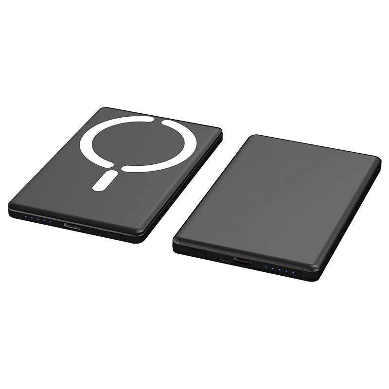 Ultra-thin dark gray magnetic power bank with alloy shell, shown next to a smartphone.