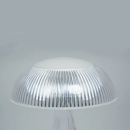 USB rechargeable acrylic table lamp with three colour changing modes on a surface.