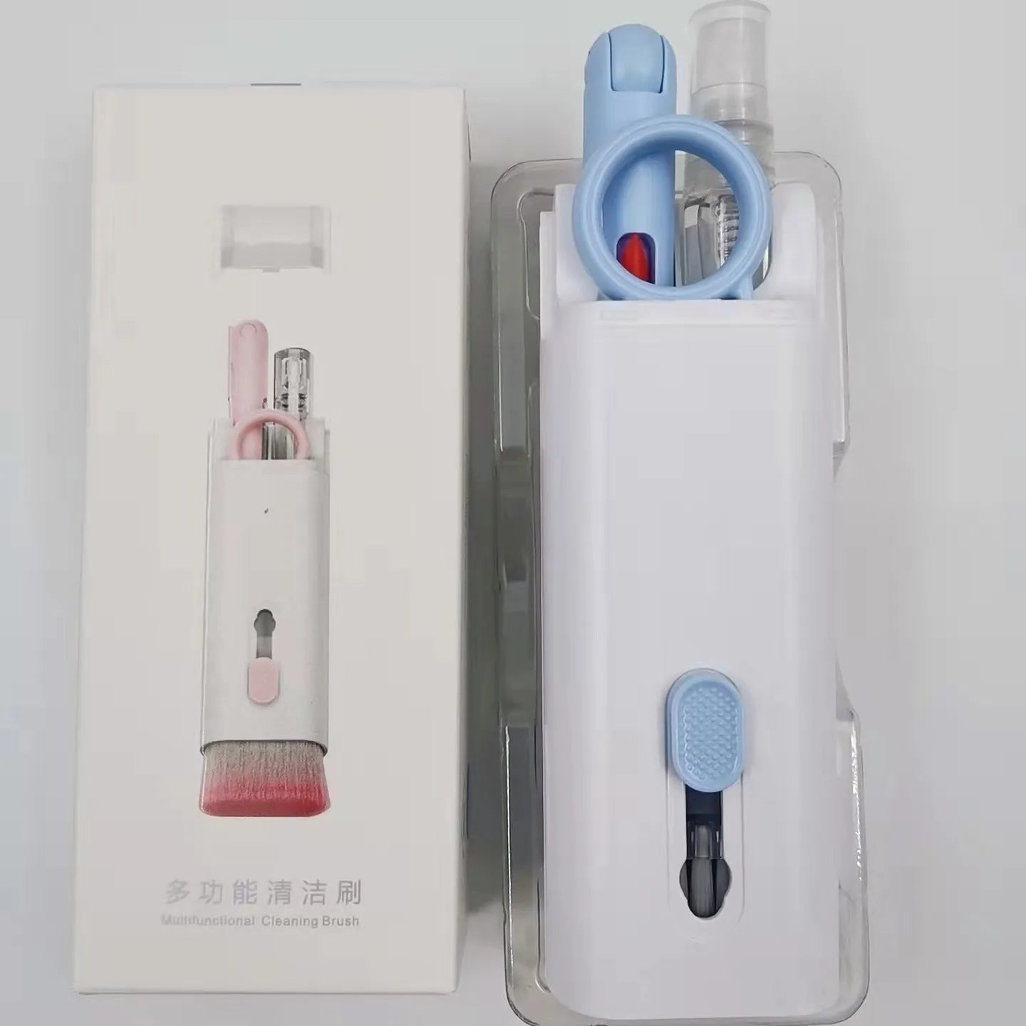 Multifunctional white cleaning pen kit open to show silicone tip, brush, keycap puller, and spray bottle for electronics.
