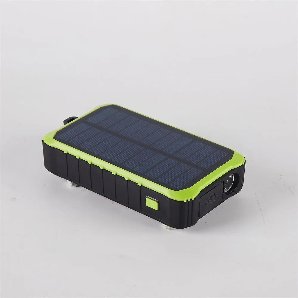 Orange and green hand solar power bank with solar panel, USB ports, and LED light showing 12000mAh capacity