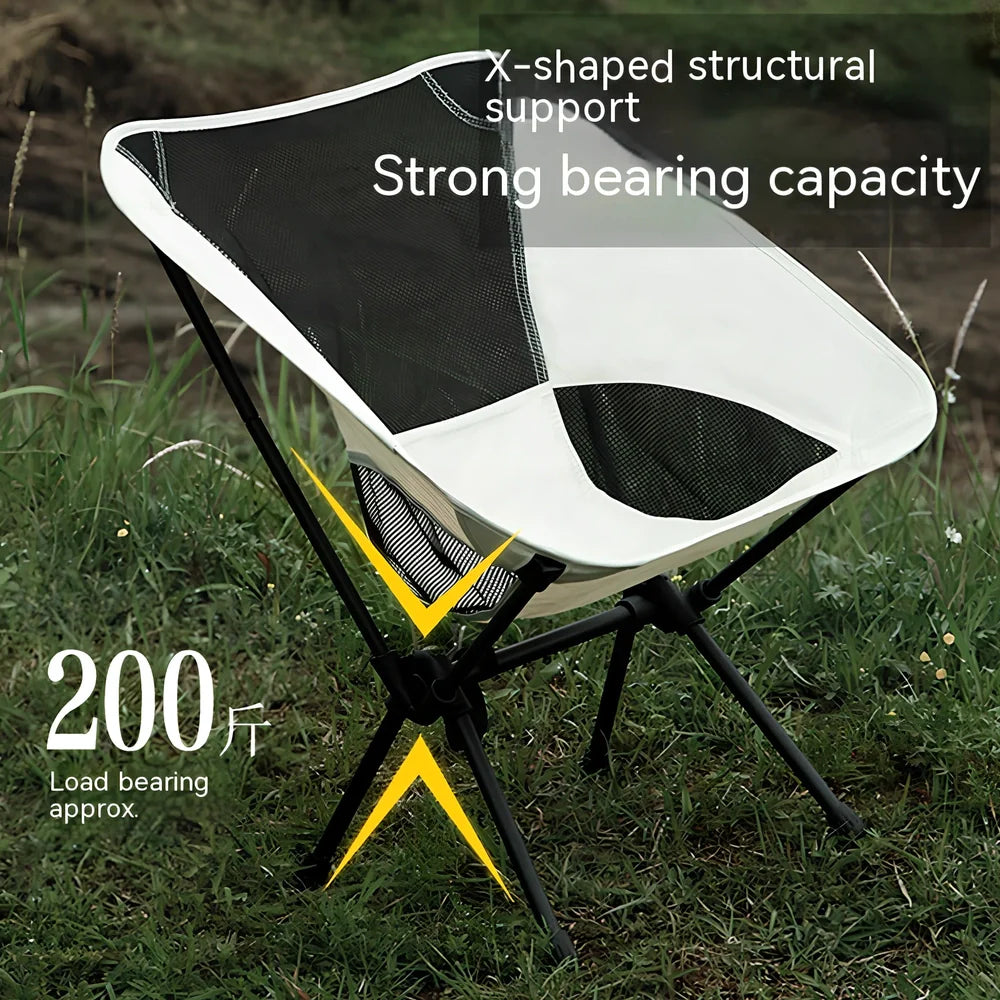 Outdoor folding chair with 600D Oxford cloth in ivory white, shown in folded position with storage bag