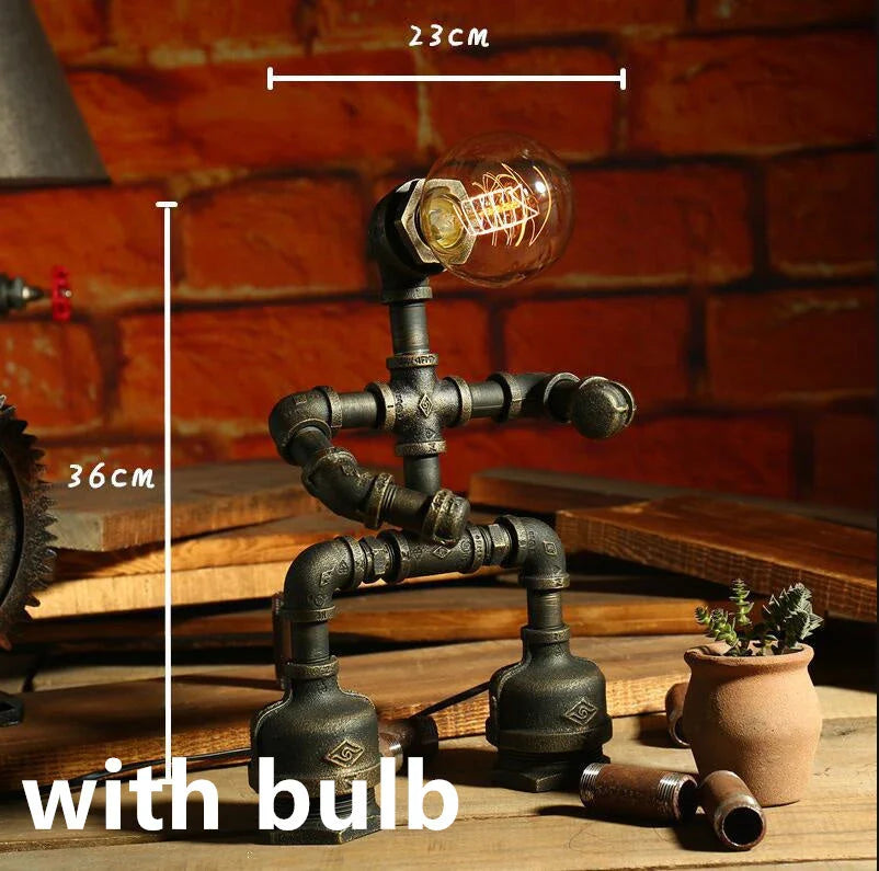 Vintage industrial iron pipe table lamp with soft, warm lighting and a green bronze finish